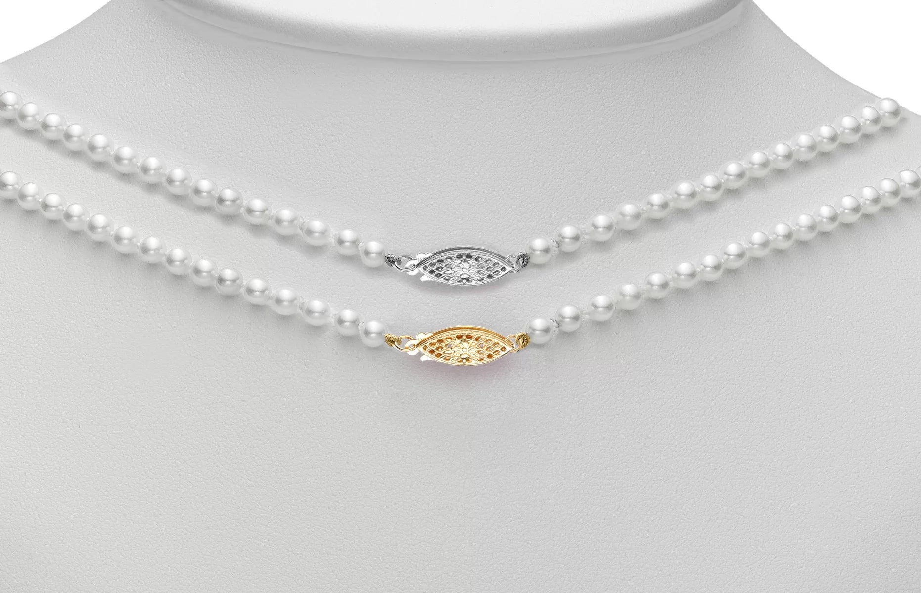 2 pearl necklaces showing filigree clasps in white gold and yellow gold