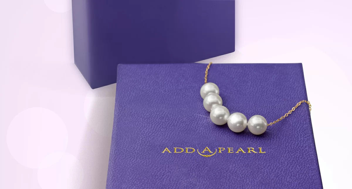 Pearl necklace on a purple Add-A-Pearl gift box
