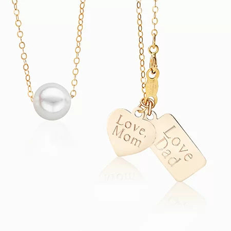 A pearl necklace and 2 engraved gold charms