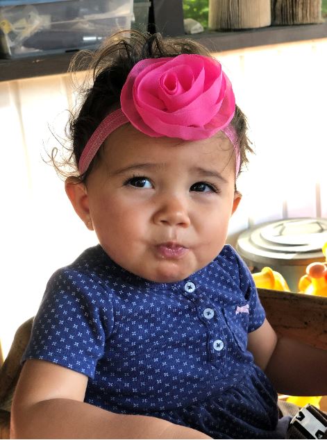 Adorable little girl with big pink bow