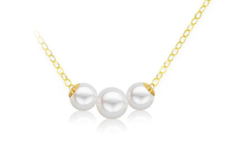 Pearl necklace with luxe gold accents on a white background