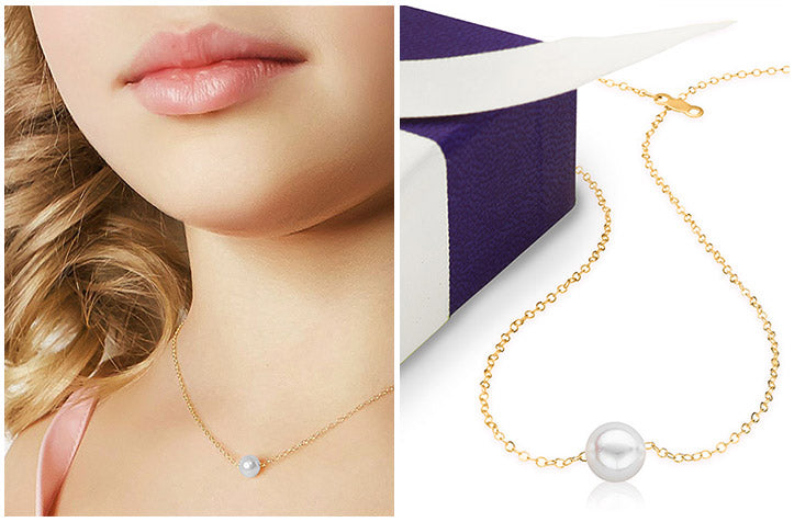 Single-pearl starter necklace shown worn on a model alongside the Add-A-Pearl purple gift box