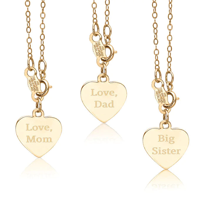 Three gold necklaces with heart-shaped pendants engraved with 'Love, Mom', 'Love, Dad', and 'Big Sister'.