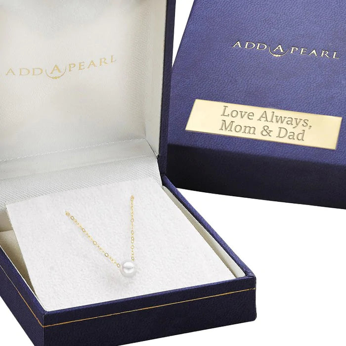 A personalized name plate on the necklace box