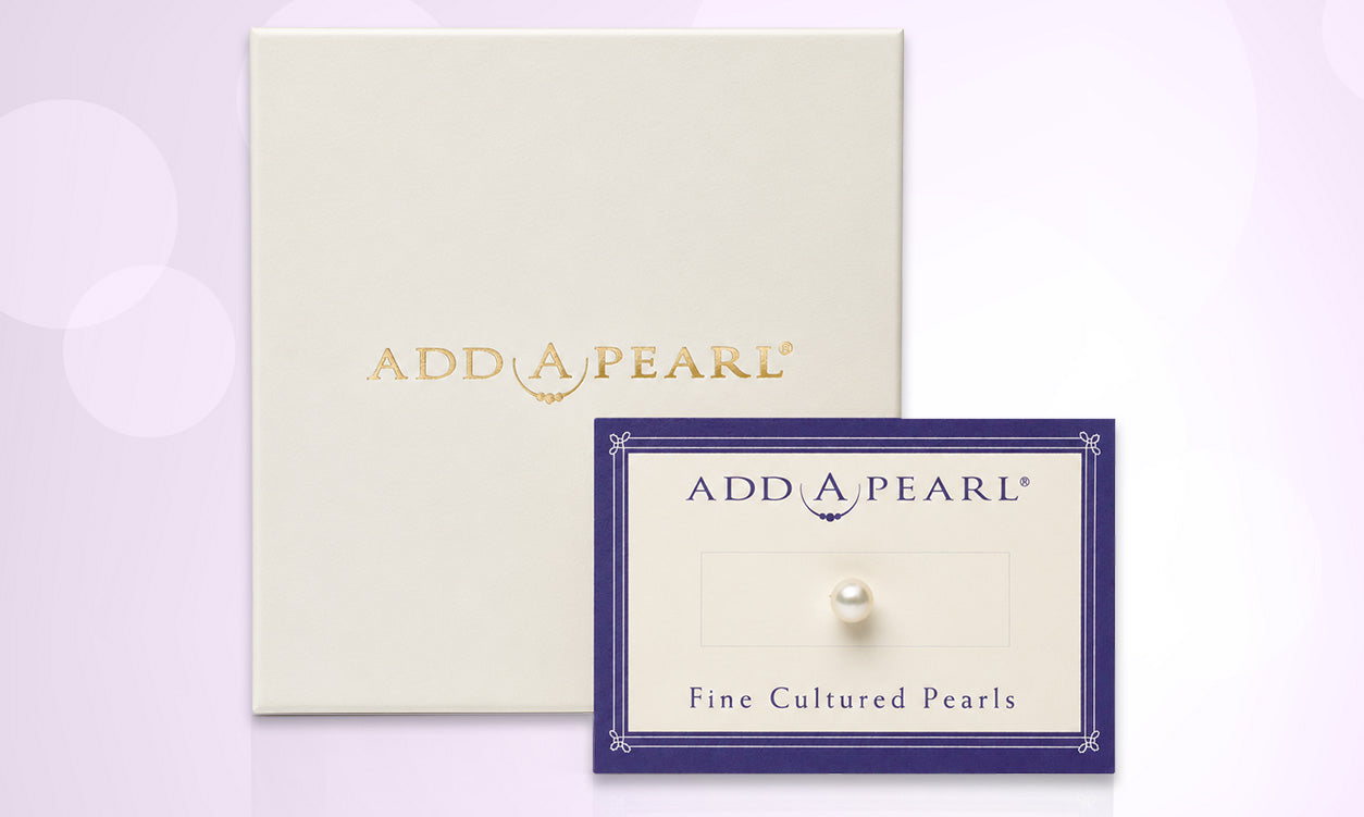 Cultured pearl on a cream-colored Add-A-Pearl card